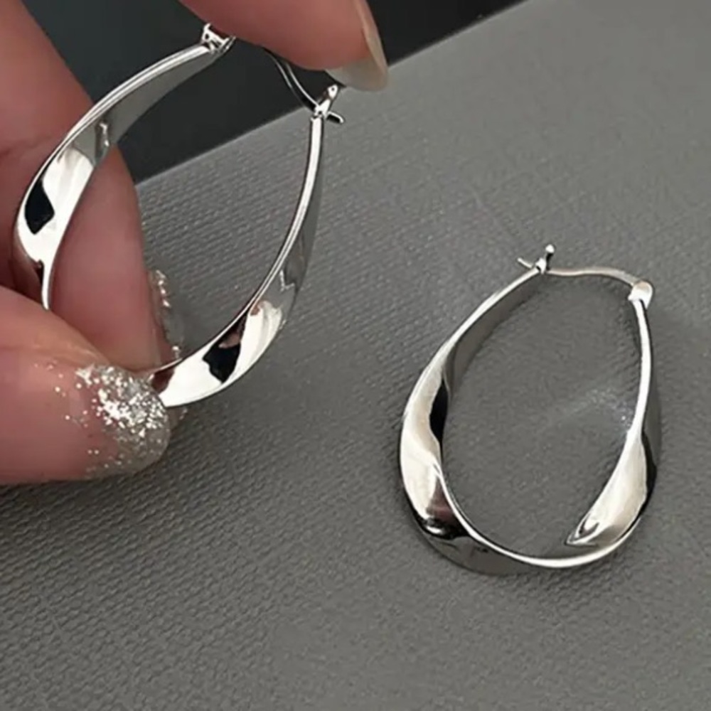 Sleek Modern Wavy Silver Toned Earrings - Picture 3 of 3